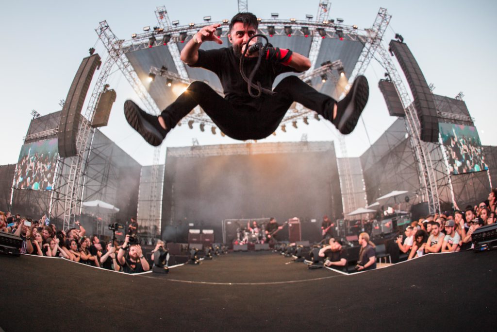 Walkways vocalist leaping from the riser on a festival main stage